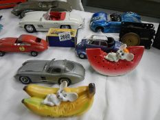 A large quantity of tinplate and diecast cars including Matchbox etc.