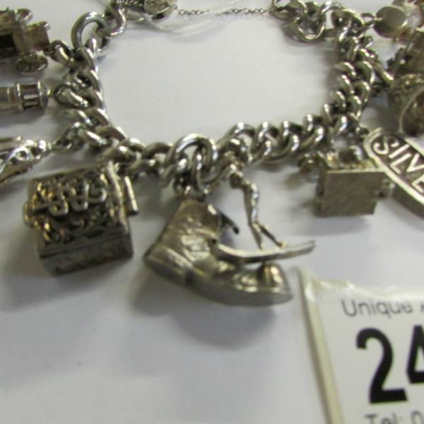 A very good quality 1970's charm bracelet with 11 charms in total including 4 opening, - Image 3 of 4