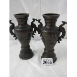 A pair of late Victorian bronze vases in good condition, 6.6".