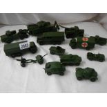 14 Dinky military vehicles including tank transporter, field gun set, ambulance etc.