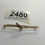 A pheasant brooch (bar stamped 9ct).