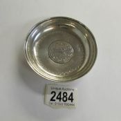 A small silver dish set central Arabic coin.