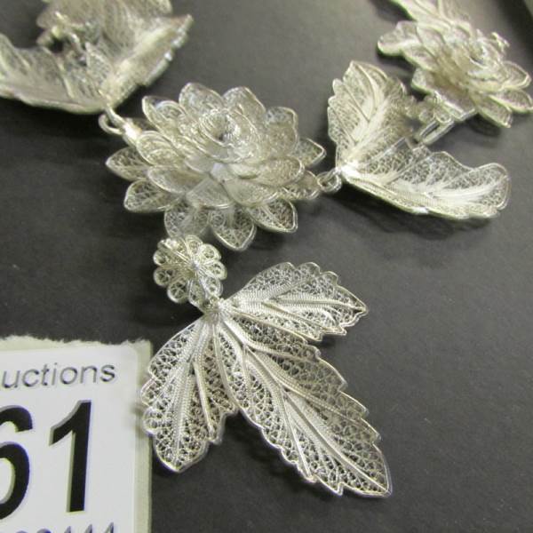 A vintage silver filigree necklace fashioned with flowers and leaves, attached pendant drop, - Image 3 of 3