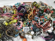 A large quantity of unsorted costume jewellery.