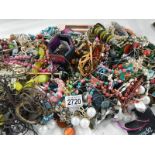 A large quantity of unsorted costume jewellery.