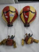 A pair of late 20th century resin hot air balloons.