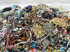 A large quantity of unsorted costume jewellery.