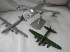 2 cast "Heavy Bomber" planes and an aluminium plane on stand, 1 a/f.