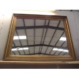 A large gilt framed mirror