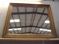 A large gilt framed mirror