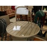 A wicker conservatory table and 4 chairs.