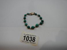 A 9ct gold bracelet set turquoise stones.