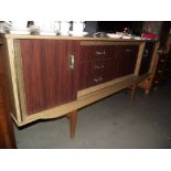 A 1970's teak melamine sideboard
