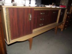 A 1970's teak melamine sideboard