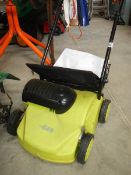 An electric lawn rake.