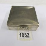 A hall marked silver cigarette box.