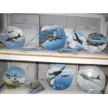 2 shelves of boxed of aviation collectors plates