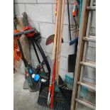 A large quantity of tools including strimmer.