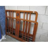 An Arts and Crafts style carved bed frame (header,