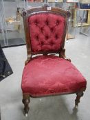 A good Edwardian bedroom chair deep buttoned in burgundy.