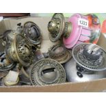 A quantity of Victorian oil lamp burners and fonts including Hinks, Postlethwaite etc.
