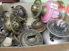 A quantity of Victorian oil lamp burners and fonts including Hinks, Postlethwaite etc.