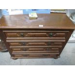An oak 4 drawer chest.