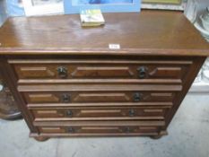 An oak 4 drawer chest.