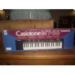 A boxed Casio MT-55 keyboard