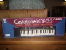 A boxed Casio MT-55 keyboard
