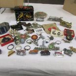 A mixed lot including badges, jewellery etc.
