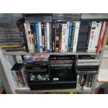 2 shelves of CD's and DVD's etc.