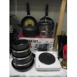 A quantity of new saucepans and a one ring cooking hob