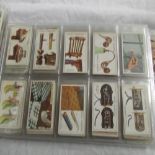 An album of cigarette cards including Wills, Player,