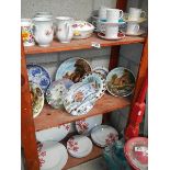 3 shelves of ceramic items.