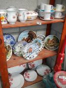 3 shelves of ceramic items.