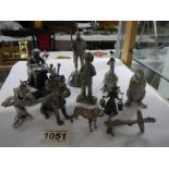A mixed lot of metal figures including lace maker, soldier, dogs, ducks etc.