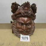 A superb quality carved hard wood wall mask.