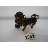 A Chinese jewelled dragon figure with nodding head.
