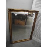 A gilded framed mirror