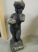 A standing cherub garden urn. 29".