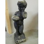 A standing cherub garden urn. 29".