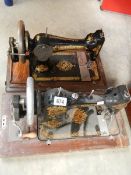 2 vintage sewing machines.