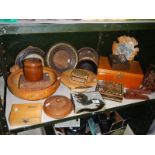 A shelf on miscellaneous wooden items including boxes.