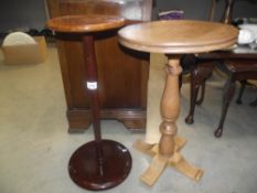 A round varnished wood pot stand and a side table