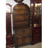 An arched top aok dresser - carved panel doors
