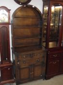 An arched top aok dresser - carved panel doors