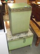 A green Lloyd Loom type glass topped laundry basket and similar blanket box seat