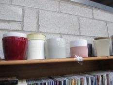A shelf of garden pots.