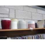 A shelf of garden pots.